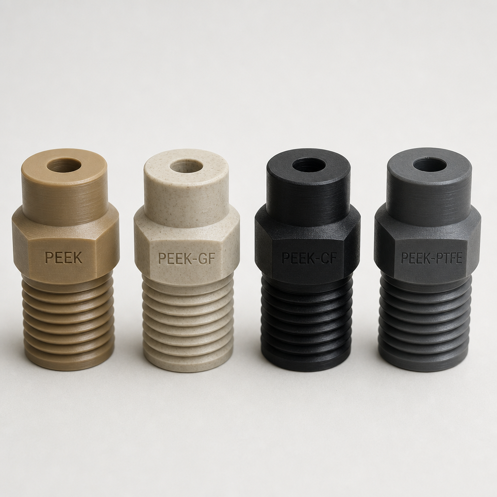 Four machined sample pieces different PEEK grades lined up: natural unfilled PEE
