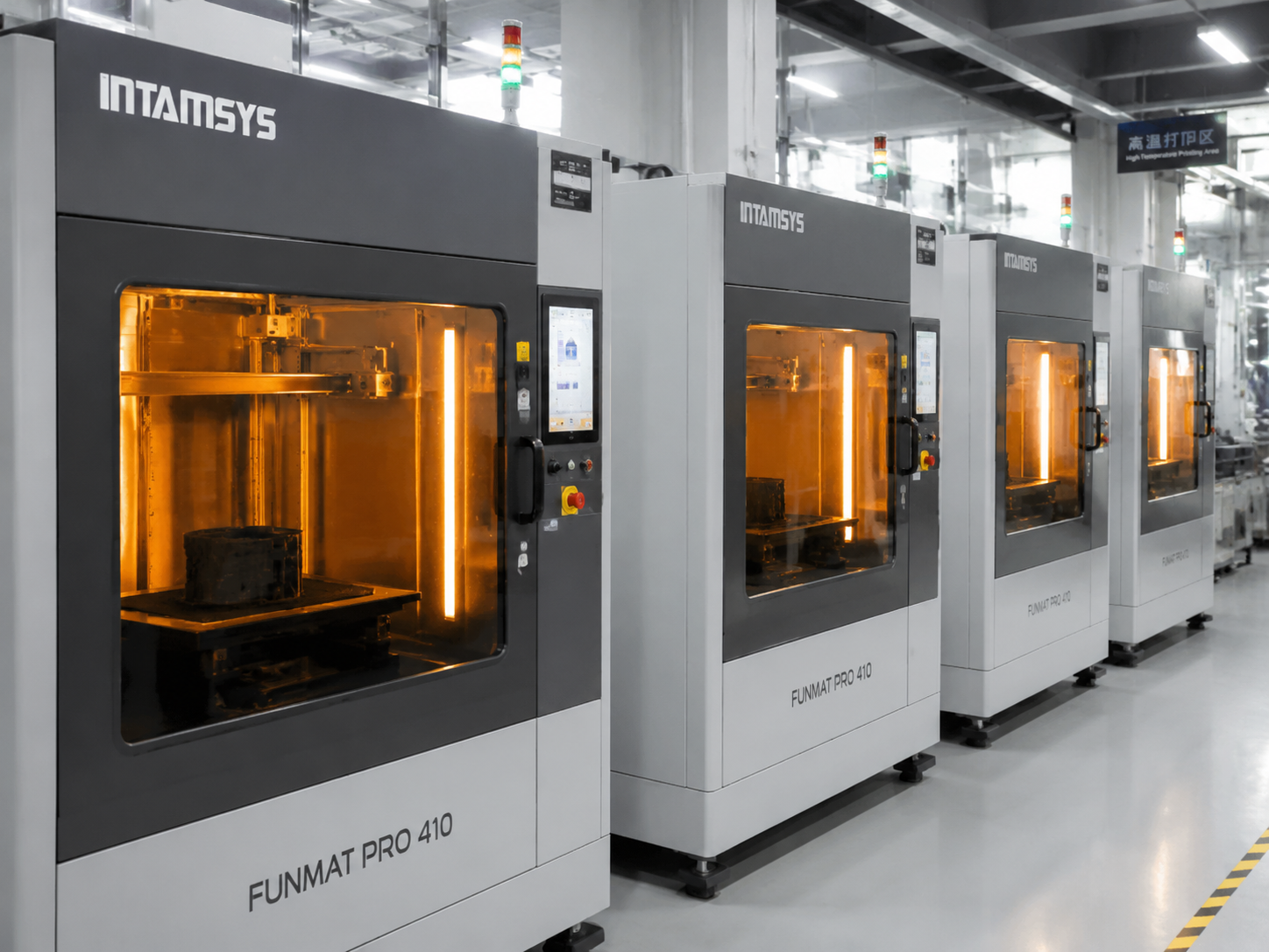 Industrial-grade FDM 3D printers lined up in engineering facility, printing high-temperature engineering materials