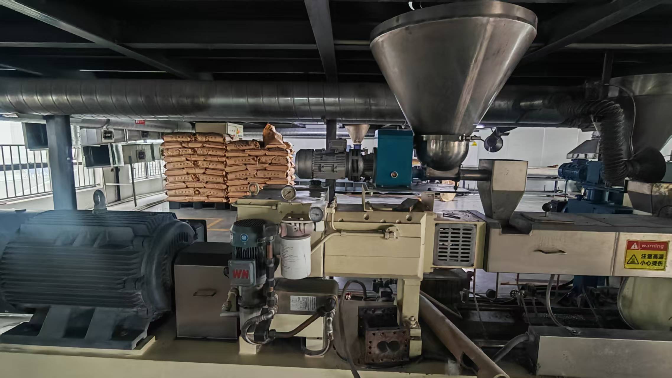 Material feeding equipment at WANHAN, Nylon Plastic’s cooperating factory