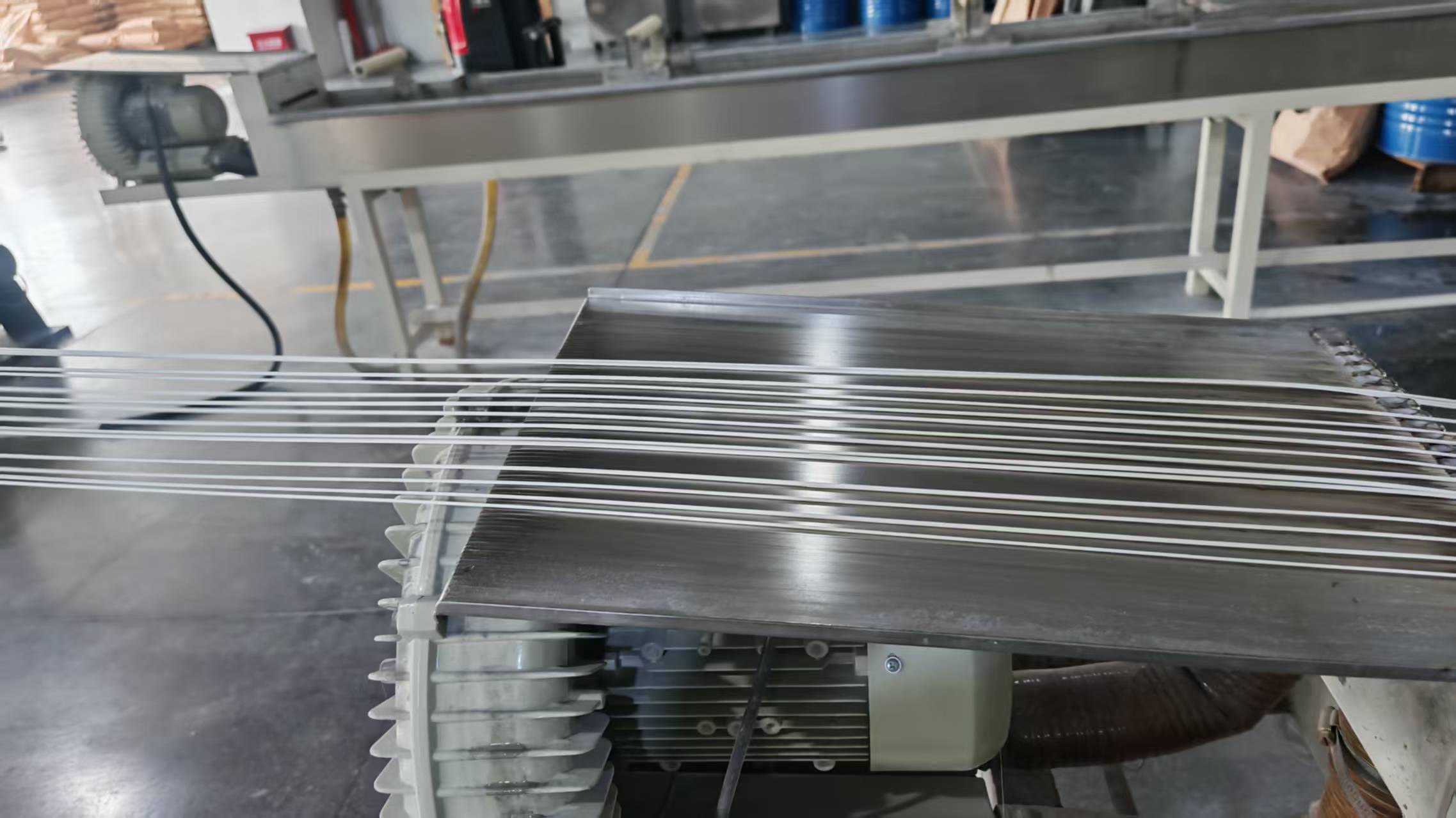 Extruded plastic strands at the WANHAN cooperating factory